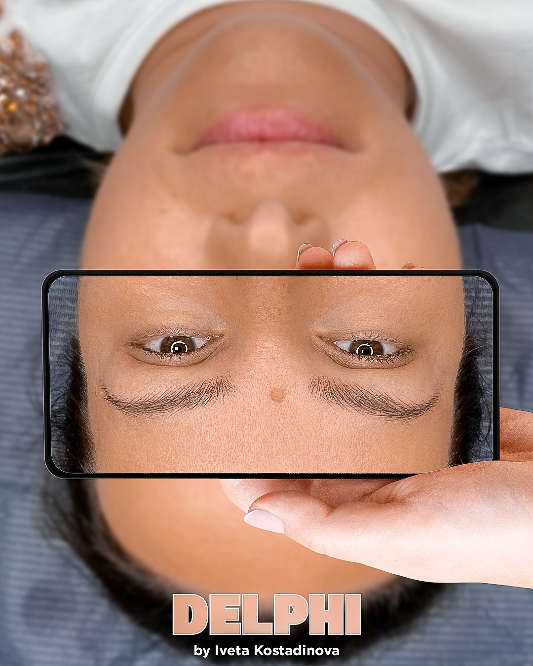 Delphi by Iveta Kostadinova — close-up of microbladed brows shown on a phone